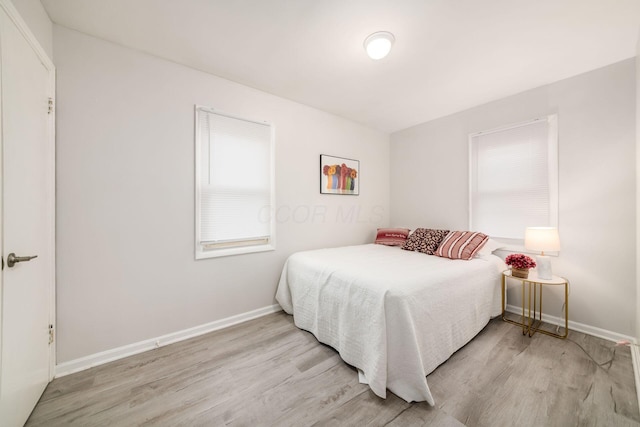 bedroom with light hardwood / wood-style flooring