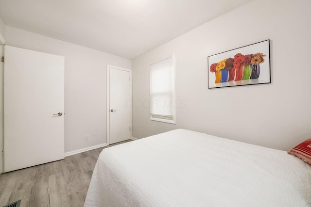 bedroom with light wood-type flooring