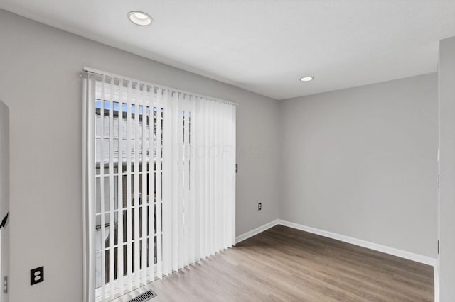 empty room with wood-type flooring