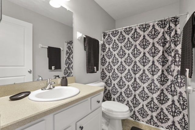 bathroom featuring toilet, tile patterned flooring, a shower with curtain, and vanity