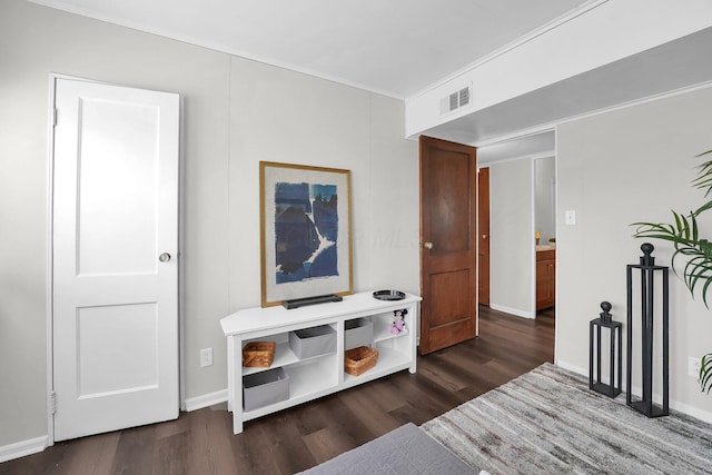 bedroom featuring visible vents, dark wood finished floors, and baseboards