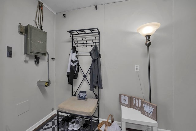 miscellaneous room featuring electric panel and baseboards