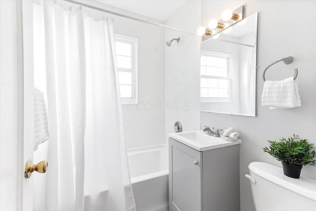 full bathroom with vanity, toilet, and shower / bath combo