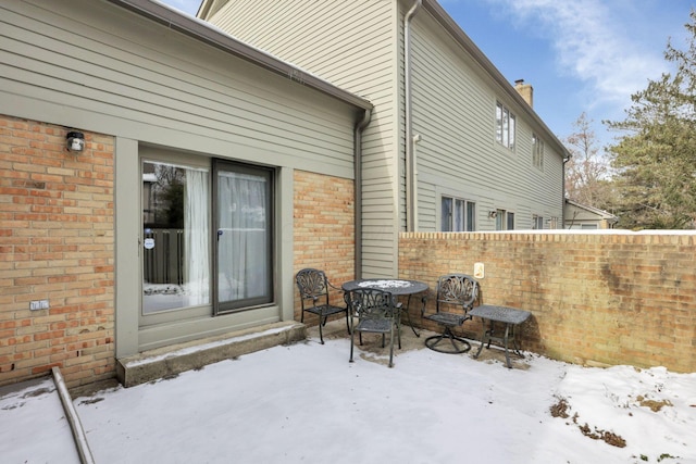 view of snow covered patio