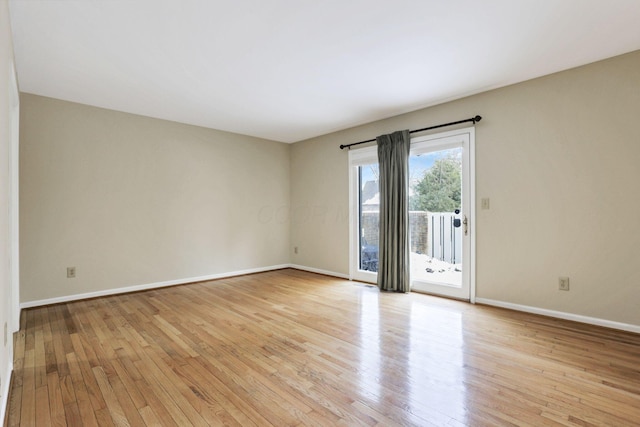 spare room with light wood-type flooring