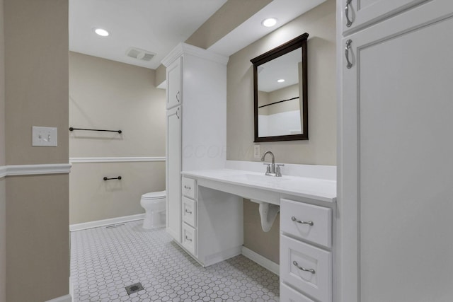 bathroom with sink and toilet