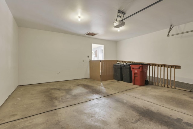 garage featuring a garage door opener