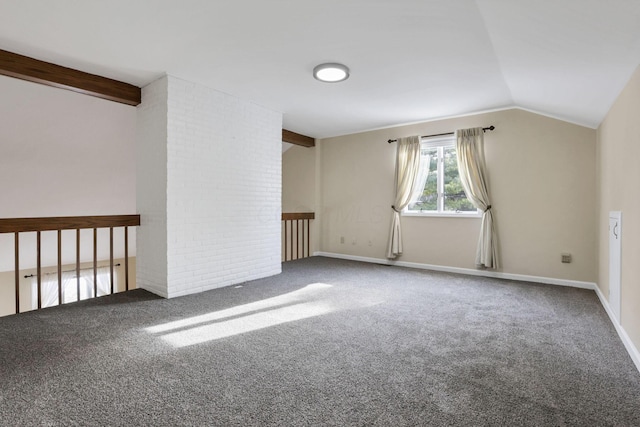 carpeted empty room featuring lofted ceiling with beams