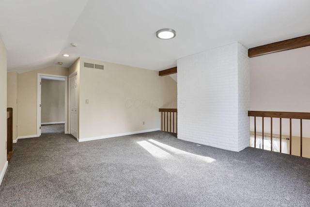 carpeted spare room with lofted ceiling with beams