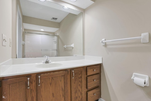 bathroom with vanity and walk in shower