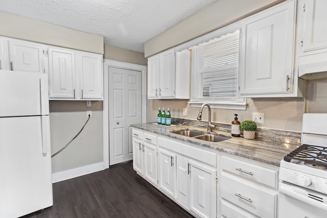 kitchen featuring white cabinetry, white appliances, and sink