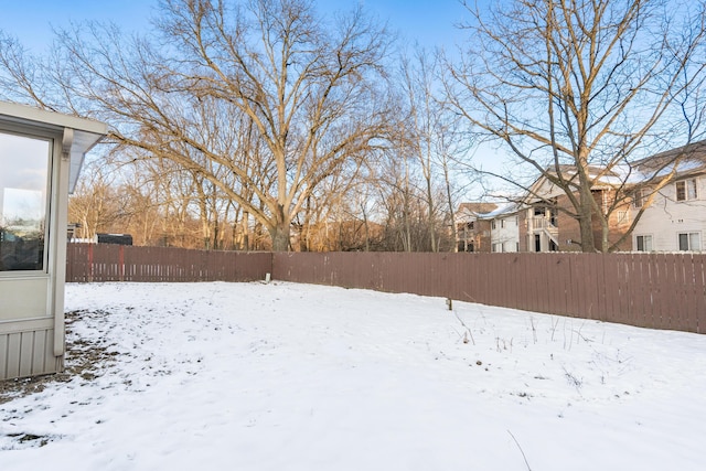 view of yard covered in snow