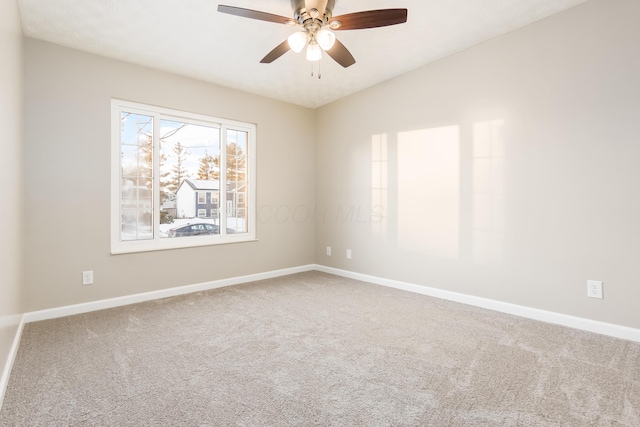 spare room featuring ceiling fan, lofted ceiling, and carpet floors