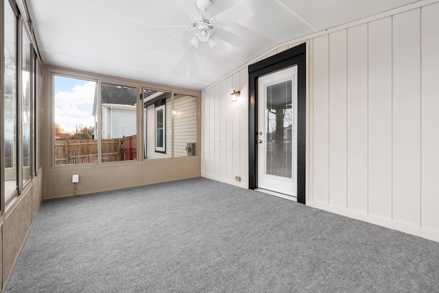 unfurnished sunroom with ceiling fan and lofted ceiling