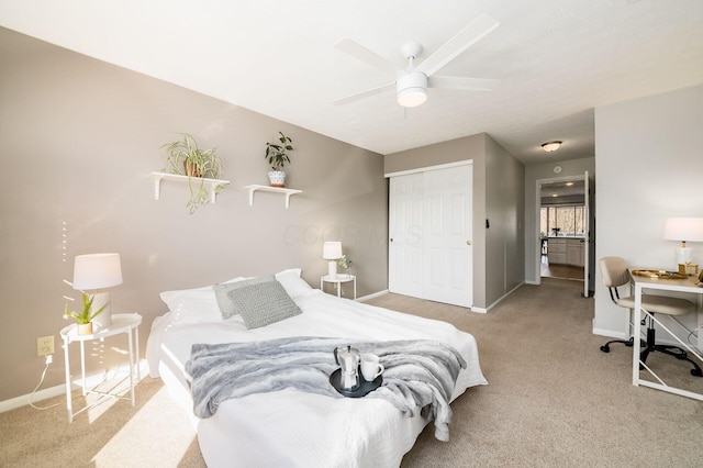 carpeted bedroom featuring ceiling fan and a closet