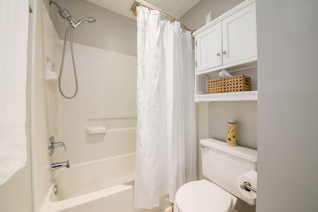 bathroom featuring shower / bath combo and toilet