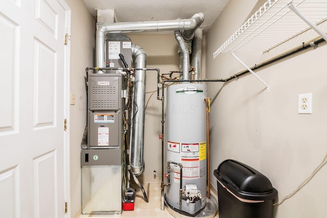 utility room featuring water heater