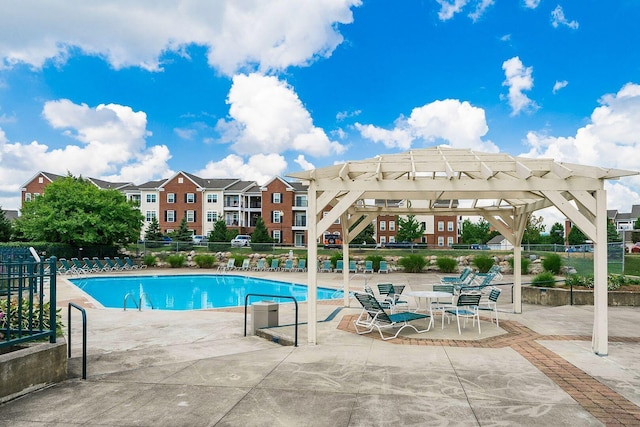 view of swimming pool with a pergola and a patio area