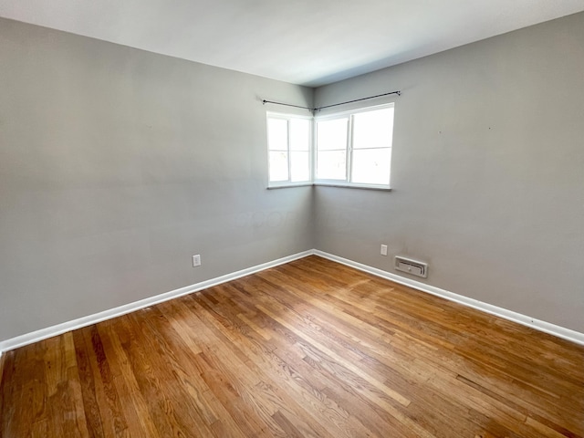 unfurnished room featuring wood-type flooring