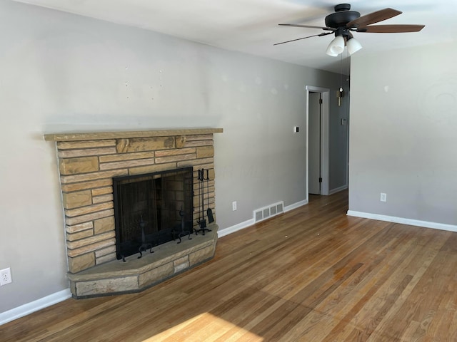 unfurnished living room featuring ceiling fan, a fireplace, and hardwood / wood-style floors