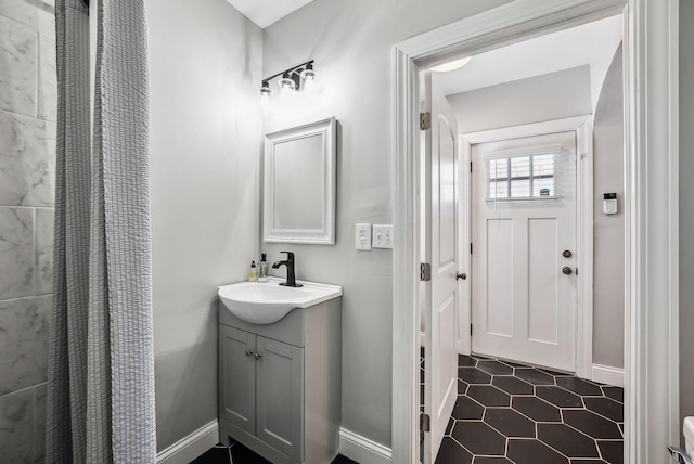 bathroom with tile patterned floors and vanity