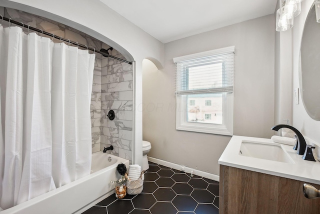 full bathroom with shower / bath combo with shower curtain, toilet, vanity, and tile patterned flooring