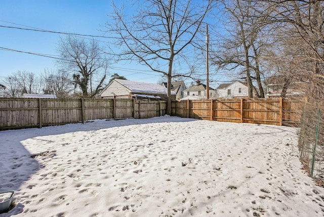 view of yard covered in snow