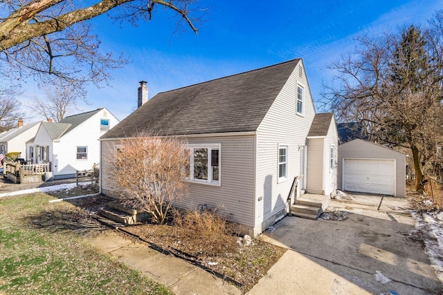 view of property exterior featuring an outbuilding and a garage