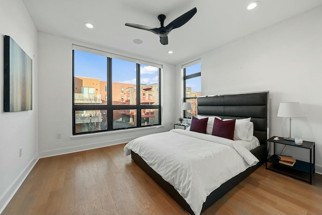 bedroom featuring wood-type flooring and ceiling fan