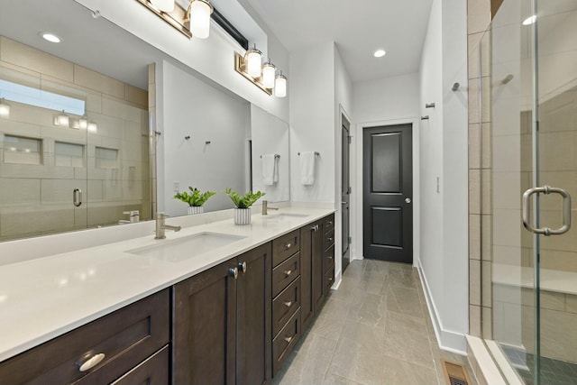 bathroom with vanity and an enclosed shower