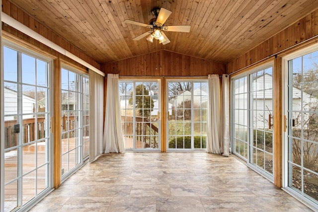 unfurnished sunroom featuring a ceiling fan, lofted ceiling, and wooden ceiling