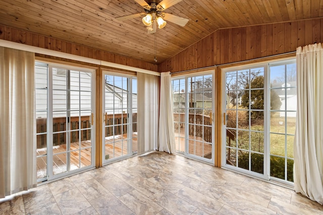 unfurnished sunroom featuring wooden ceiling, vaulted ceiling, and ceiling fan