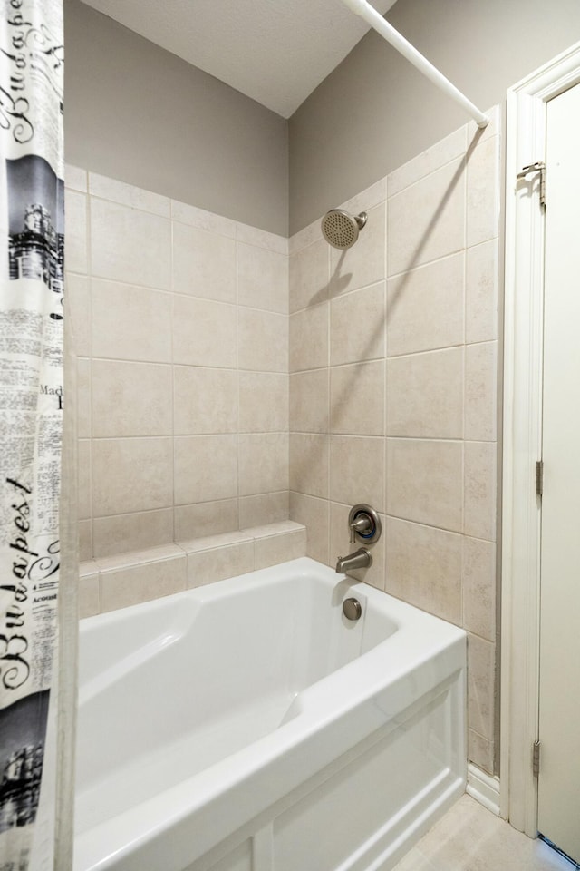 bathroom featuring shower / bath combination with curtain