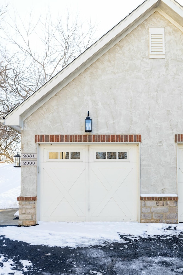 view of snow covered garage