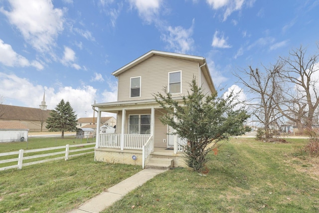 view of front of home featuring a porch and a front lawn