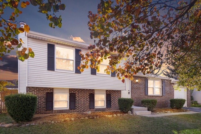 view of front of home with a yard