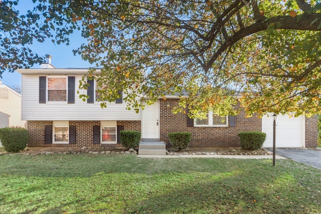 view of front of property with a garage and a front yard