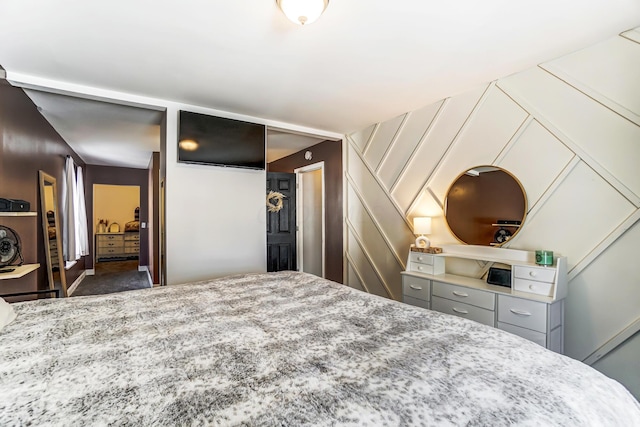 bedroom featuring dark colored carpet