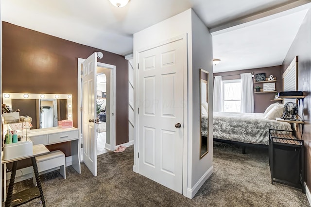 bedroom featuring dark colored carpet