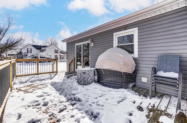 view of snow covered deck