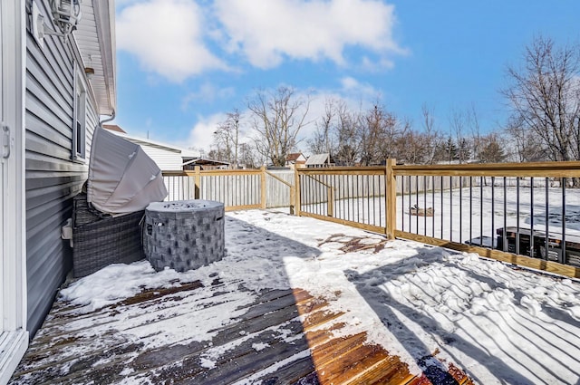 view of snow covered deck