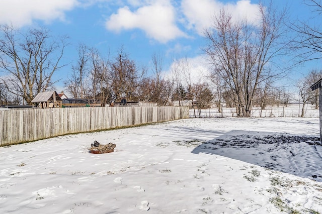 view of yard covered in snow