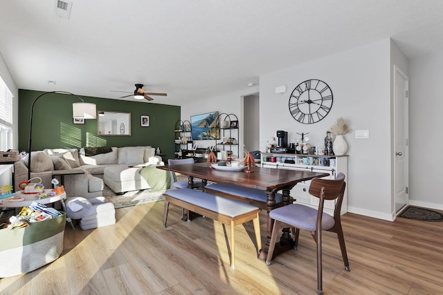 dining room featuring ceiling fan and light hardwood / wood-style flooring