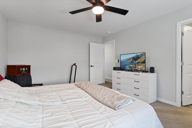 bedroom featuring light carpet and ceiling fan