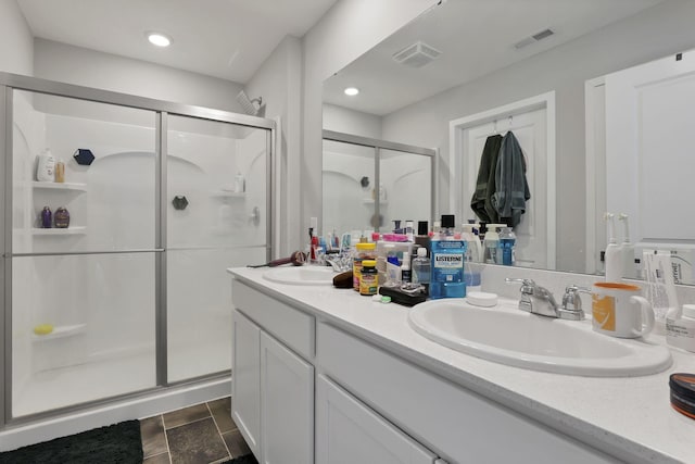 bathroom featuring vanity and walk in shower