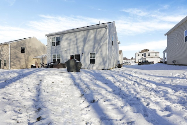 view of snow covered house