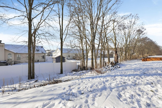 view of yard layered in snow