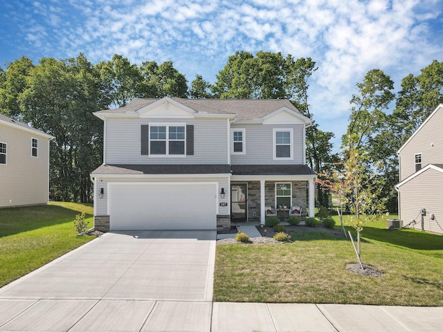 view of property featuring a front lawn, central AC unit, and a garage