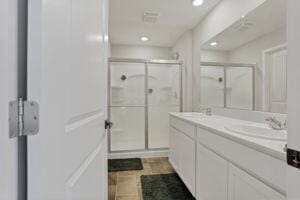 bathroom with vanity and walk in shower