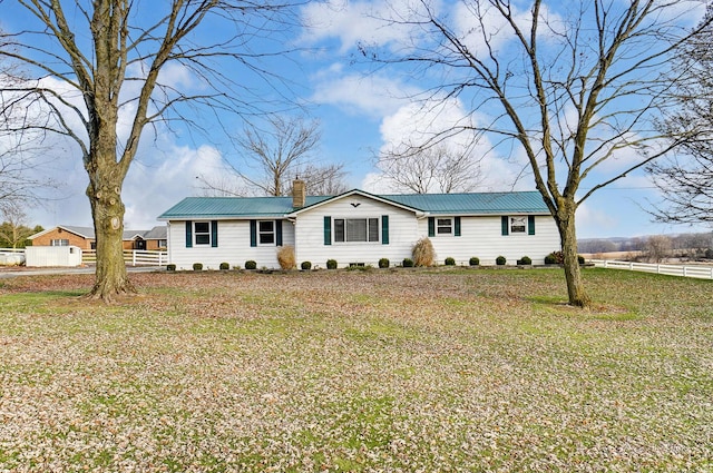 ranch-style home with a front yard